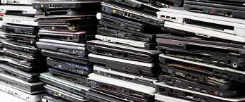 Laptop recycling service in Bangalore. 2 Decommissioned corporate laptops and old office notebooks organized for IT asset recycling and hardware disposal